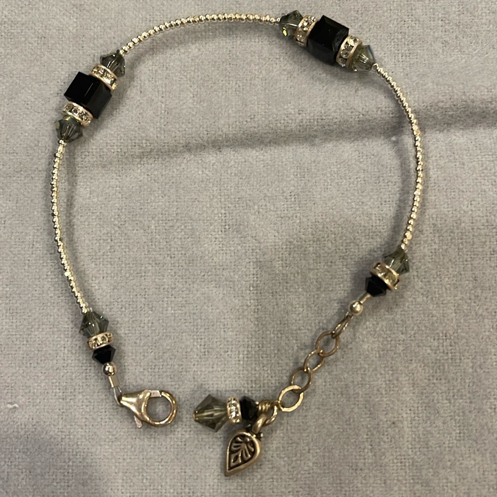 Pretty silver, black and rhinestone costume bracelet. 8” long, unknown brand.